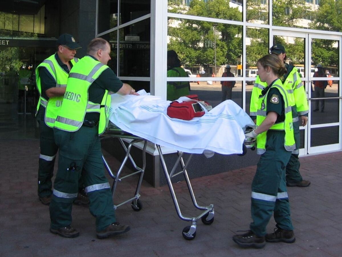 Paramedics shifting patient on stretcher in Ghaziabad
